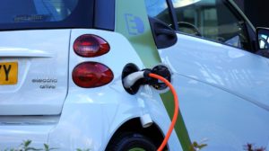 image of an electric vehicle plugged in and charging